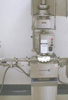 Genesis West#NPW-575, capper,up to 120 vials/min.,3 spindle crimping mechanism,star wheel index w/feed & discharge conveyor,#38707
