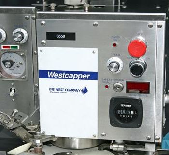 Genesis West#NPW-575, capper,up to 120 vials/min.,3 spindle crimping mechanism,star wheel index w/feed & discharge conveyor,#38707