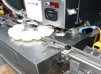 Genesis West#NPW-575, capper,up to 120 vials/min.,3 spindle crimping mechanism,star wheel index w/feed & discharge conveyor,#38707