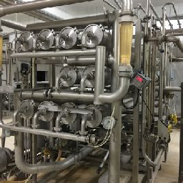 Máquina de producción, envasado y porcionado de queso APV 9091.