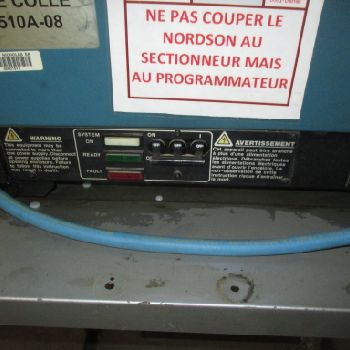 NORDSON 3400 sticker on stainless steel platform