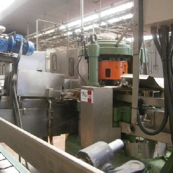 Comaco vacuum dosage and seamer group for cans.