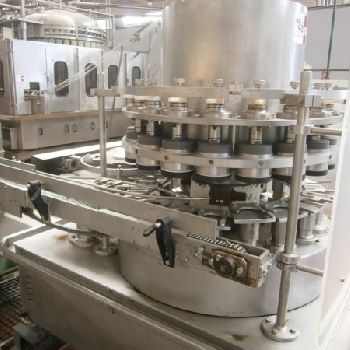 Comaco vacuum dosage and seamer group for cans.