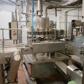 Comaco vacuum dosage and seamer group for cans.