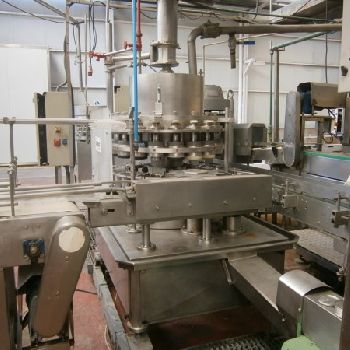 Comaco vacuum dosage and seamer group for cans.