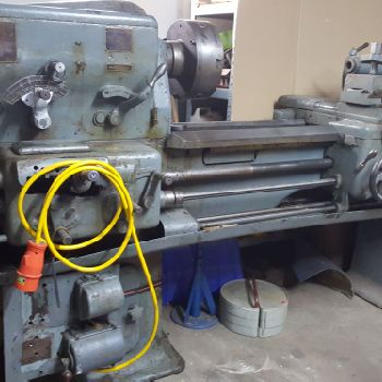 Cock and piston lathe