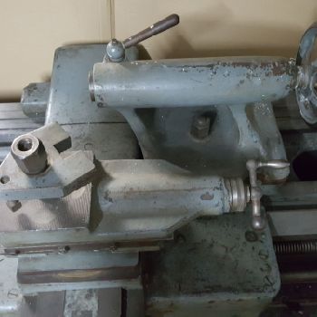 Cock and piston lathe