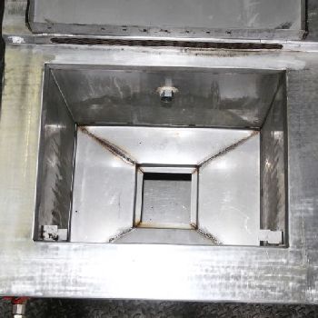 A Stainless Steel Chambered Spray And Drain Tank.