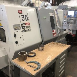 Haas#SL-30, CNC lathe,30" swing,12 chuck,3 bar,16 turning diameter,34 turning length,39 centers,3400 RPM,30 HP,2006,#7498