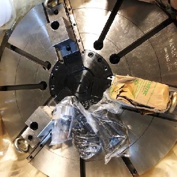 33.5" Doosan #VT900, 39.4 sw,32 chuck,3-jaw, 12 turret, Fanuc I, 2-speed gearbox, 2013