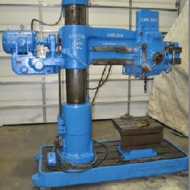 4’-11"Carlton#1A, radial drill, #4MT,22 x 24 T-slotted knee table,coolant pump,5 HP
