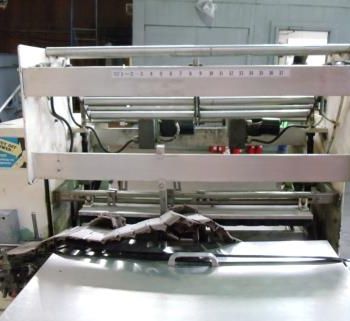 Omega #DL27, dual lane shrink bundler,13-37 bundles/minute,60-150 containers/minute,right angle infeed,#35532