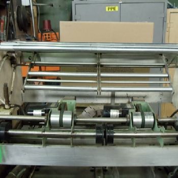 Omega #DL27, dual lane shrink bundler,13-37 bundles/minute,60-150 containers/minute,right angle infeed,#35532