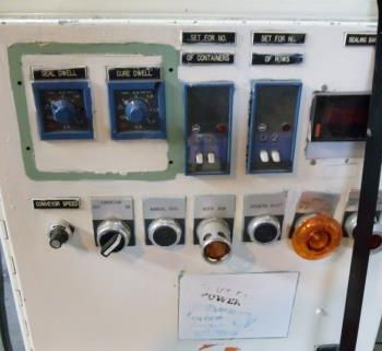 Omega #DL27, dual lane shrink bundler,13-37 bundles/minute,60-150 containers/minute,right angle infeed,#35532