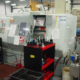 Haas#SL-30T, w/barfeed,30" swing,10 chuck,3 bar,30 HP,17 x 34 turret,prog.tailstock,mint,’08