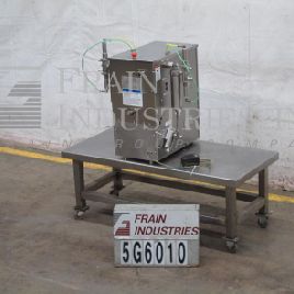 Filamatic#DAB-A-32-2, semi-automatic, 2 head table top Stainless Steel piston filler, 1-24 cycles per minute