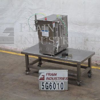 Filamatic#DAB-A-32-2, semi-automatic, 2 head table top Stainless Steel piston filler, 1-24 cycles per minute